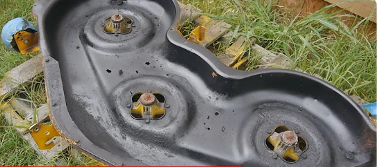 how do you keep grass from sticking to mower deck